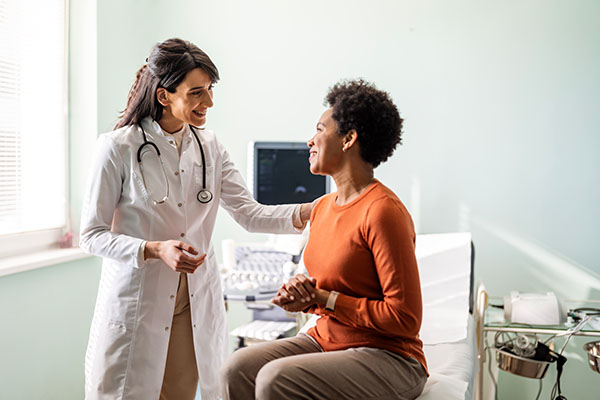 Female medical practitioner reassuring a patient - stock photo